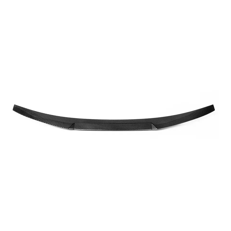 Close-up of Audi RS5 carbon fiber trunk spoiler showing aerodynamic design