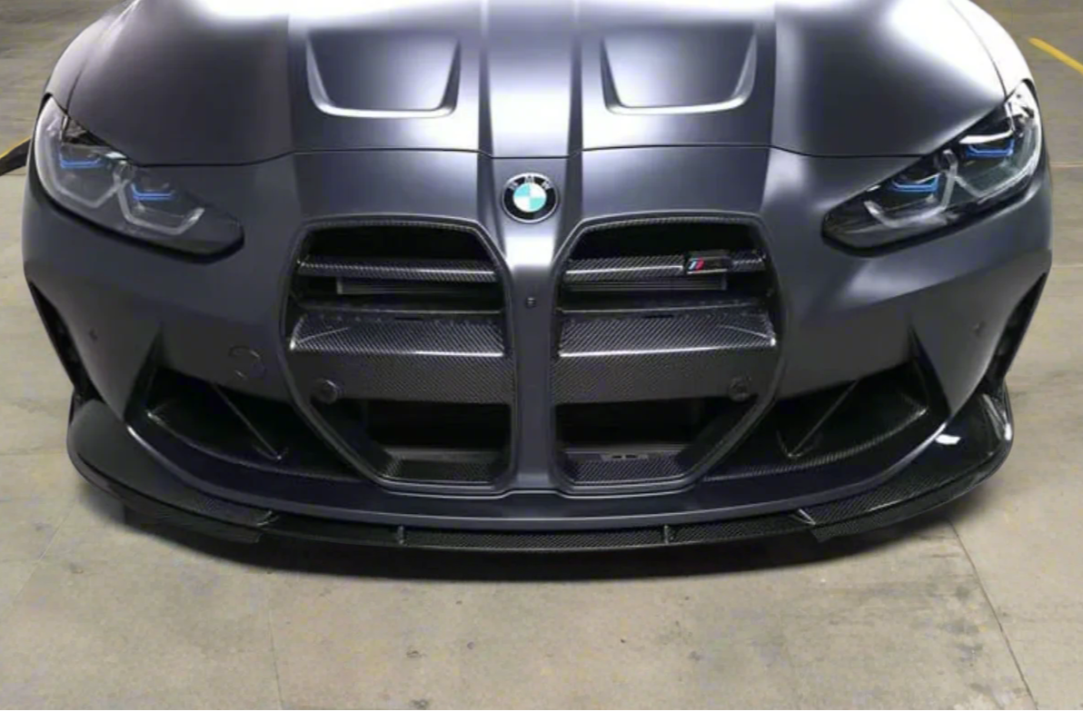 Close-up of 3D carbon fiber BMW G80 M3 front lip – glossy finish