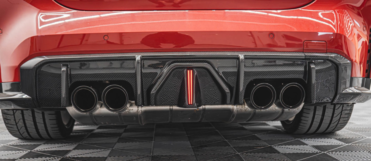 AK Style carbon fiber rear diffuser on BMW G80 M3 side angle