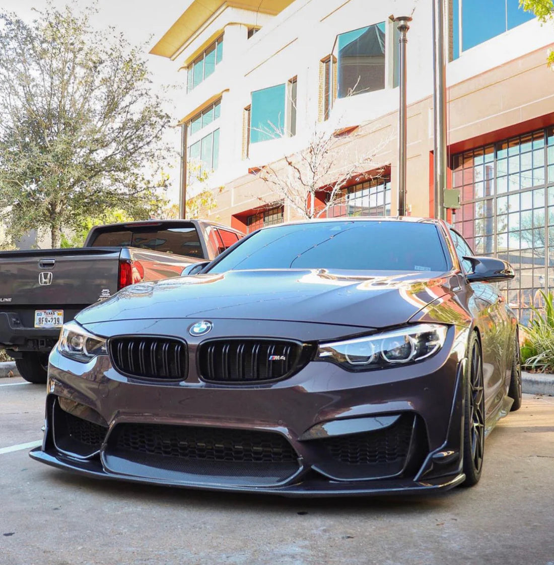 BMW F82 M4 with Laptor style carbon fiber front lip side view