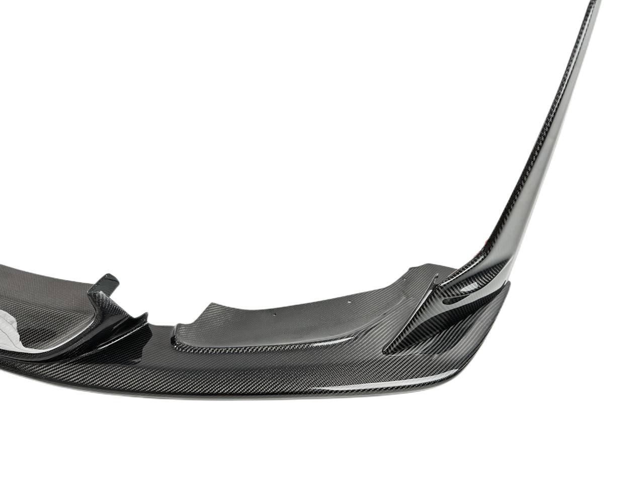 Close-up of carbon fiber texture on BMW F80 M3 front lip