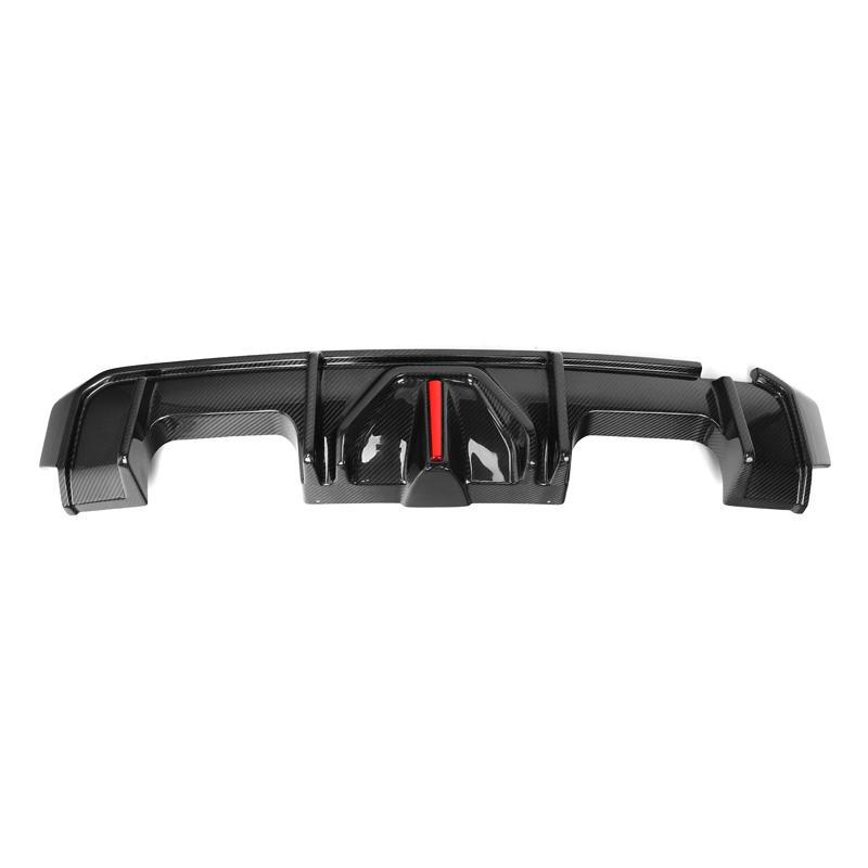 Close-up of BMW G80 M3 rear diffuser carbon fiber texture