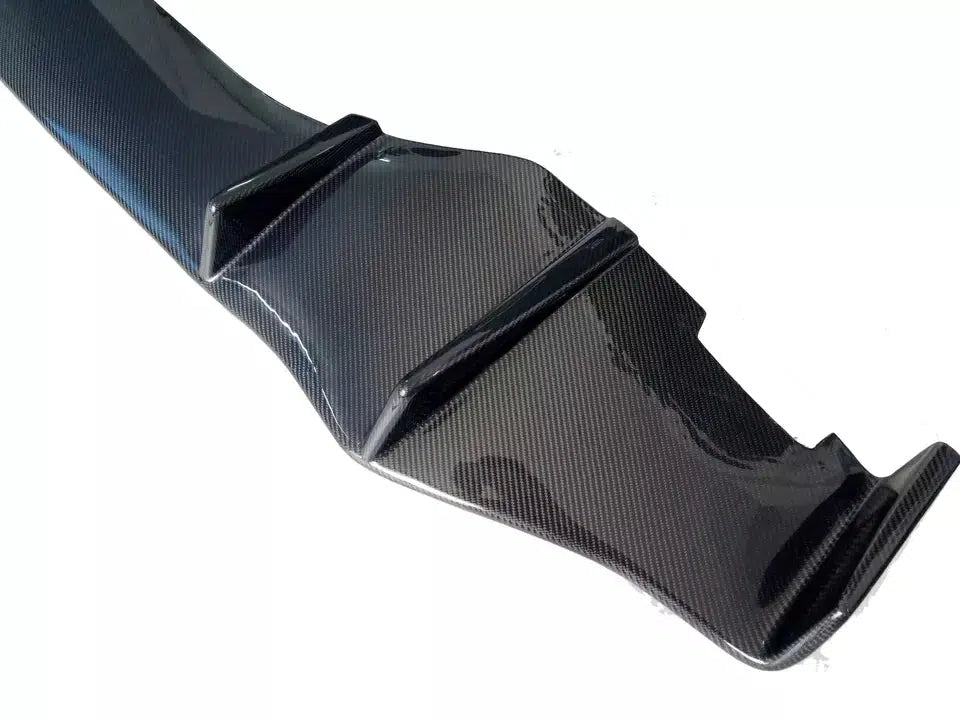 Rear close-up of Lamborghini Huracan carbon fiber diffuser showing sculpted fins